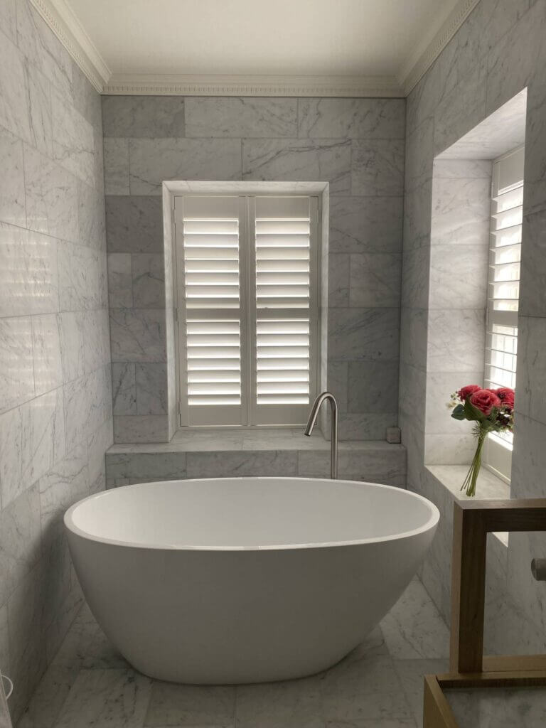 bathroom shutters done with white pvc shutters, in hawthorn