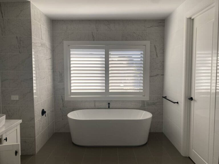 bathroom waterproof white pvc shutters. 89mm blades done in toorak